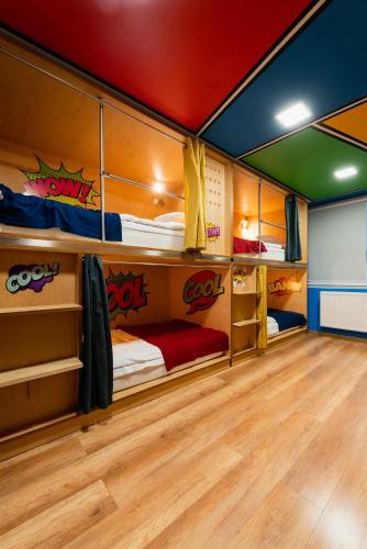 a room with three bunk beds in a house at Good Times House in Katowice