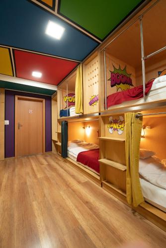 a room with bunk beds and a hallway at Good Times House in Katowice