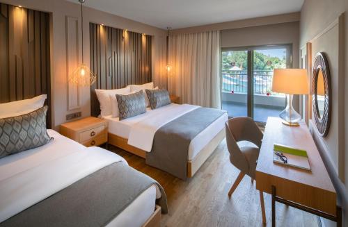 Postel nebo postele na pokoji v ubytování Barut Hemera - Ultra All Inclusive