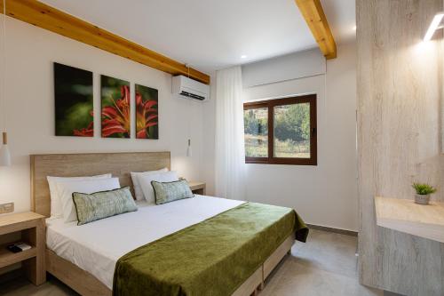 a bedroom with a large bed in a room at Fotinou Villa, a secret retreat, By ThinkVilla in Fotinós
