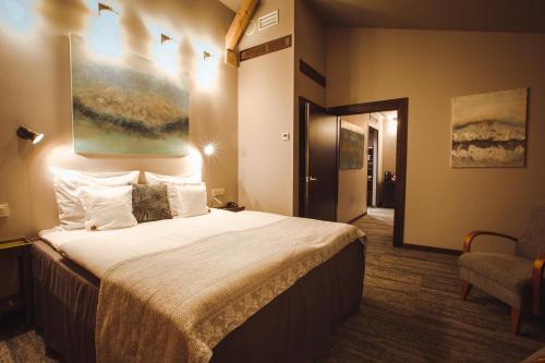 Postel nebo postele na pokoji v ubytování Promenade Hotel Liepaja