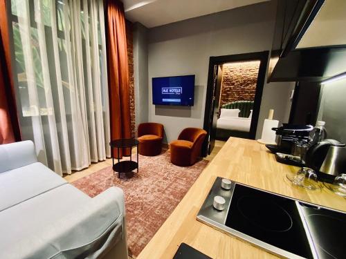 a kitchen and living room with a couch and a sink at RUZ Hotels in Istanbul