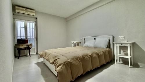 Posteľ alebo postele v izbe v ubytovaní Vivienda Paseo 9 Baeza