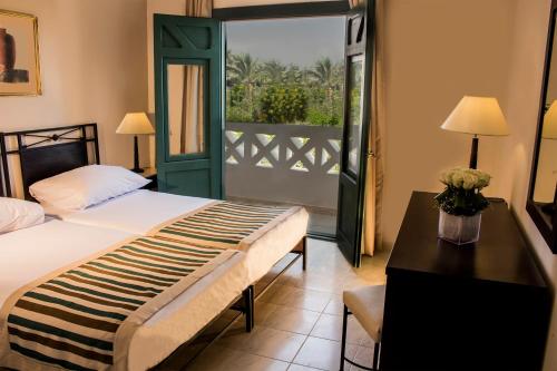 Ένα ή περισσότερα κρεβάτια σε δωμάτιο στο Solymar Naama Bay