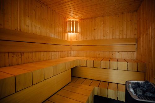 a wooden sauna with a light in the middle at Hotel Glaus in Banská Štiavnica