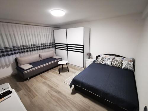 Posteľ alebo postele v izbe v ubytovaní Ema Studio Apartman