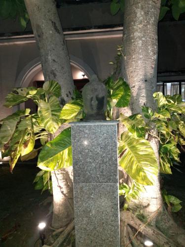 a statue of a koala sitting next to a tree at Gardenia 29 in Raichak