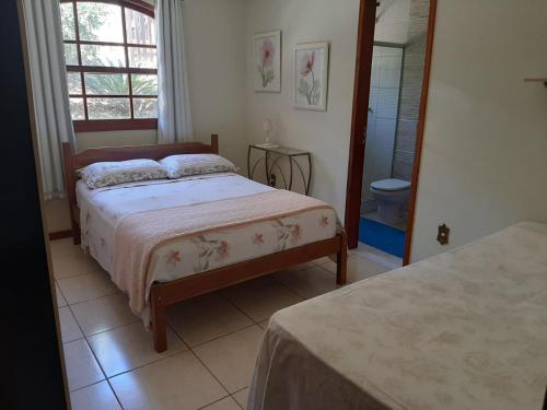 Postel nebo postele na pokoji v ubytování Casa de Campo Teresópolis