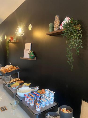 a table with a bunch of food on at Sure Hotel by Best Western Bordeaux Lac in Bordeaux