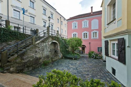 
a stone walled area with a stone building at das-hornsteiner in Passau
