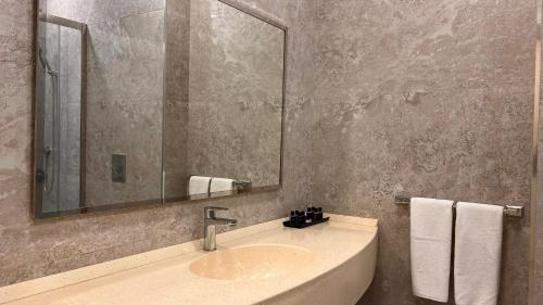 Un baño de ILK INN HOTEL