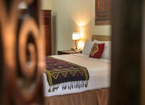 Posteľ alebo postele v izbe v ubytovaní Toraja Misiliana Hotel