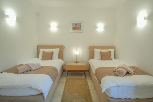 Postel nebo postele na pokoji v ubytování Casa Monte Cristo Apartments - Lemon