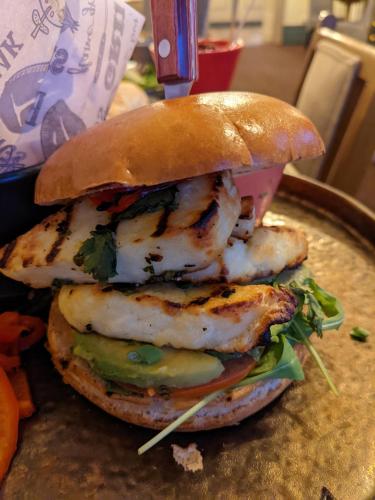 a close up of a chicken sandwich on a bun at Hotel Rudyard in Leek