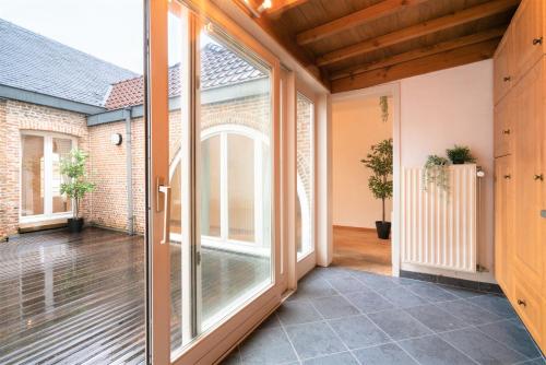 an internal view of a balcony with sliding glass doors at The Capital Street Lodge in Antwerp
