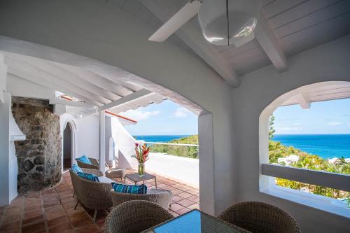 a dining room with a view of the ocean at Windjammer Landing Villa Beach Resort in Gros Islet