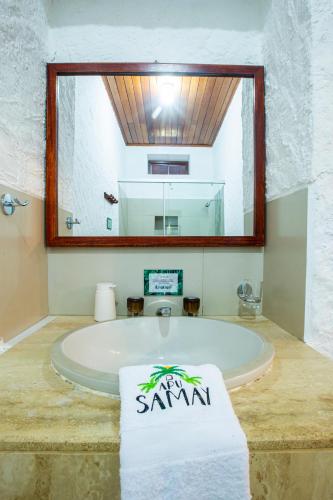 a bathroom with a bath tub with a towel at Apu Samay Nature Lodge in Tarapoto