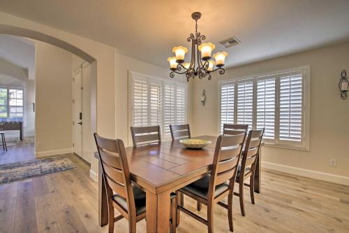 a dining room with a wooden table and chairs at Gilbert Group Getaway 3 Mi to Dtwn in Gilbert