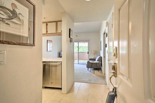 a hallway with a door leading to a living room at Cute Condo Half-Mi to Downtown Cathedral City in Cathedral City