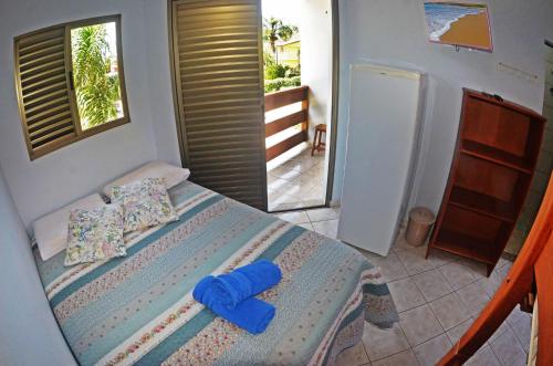 Katil atau katil-katil dalam bilik di La Ferrugem Suites - 100 mts da Praia