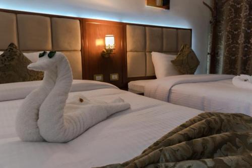Ένα ή περισσότερα κρεβάτια σε δωμάτιο στο Gleem Luxury Apartments Elite
