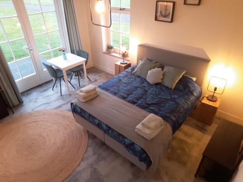 Postel nebo postele na pokoji v ubytování Bed no breakfast de Kapitein