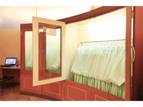 a mirror and a window in a room with a desk at R&B HOTEL MORIOKA EKIMAE - Vacation STAY 38798v in Morioka