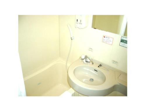 a bathroom with a sink and a toilet and a tub at R&B HOTEL MORIOKA EKIMAE - Vacation STAY 38792v in Morioka