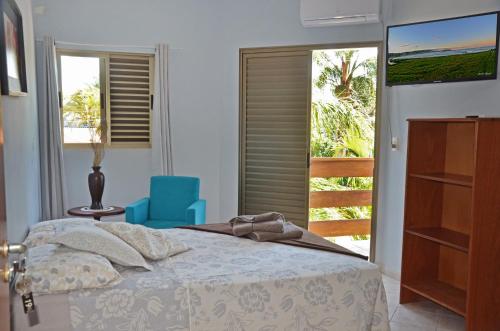 Cama o camas de una habitación en La Ferrugem Suites - 100 mts da Praia