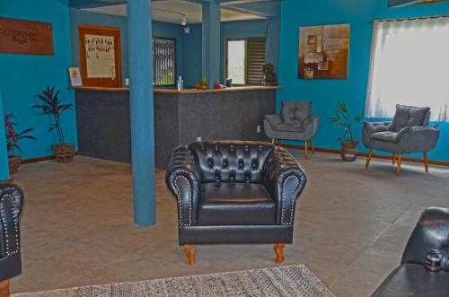 Ruang duduk di La Ferrugem Suites - 100 mts da Praia