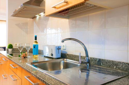 a kitchen with a sink and a counter top at Villa Jesús Lanzarote-Papagayo in Yaiza