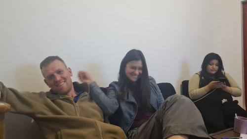 a group of people sitting on a couch at SK Hostal in Cusco