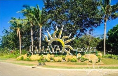 a sign in the middle of a park with palm trees at Luxury Villa at Mariveles Bataan Philippines Ph in Mariveles