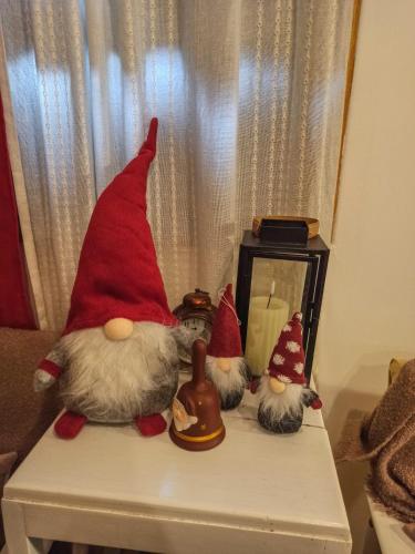 a group of santa claus figurines on a table at Dorina hiža in Karlovac