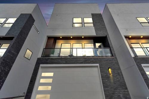 an external view of a building with a large window at The Suite Spot! Downtown Skyline Views! Sleeps 12 in Houston
