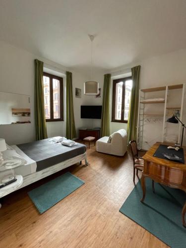 A bed or beds in a room at Appartamento Stazione Termini