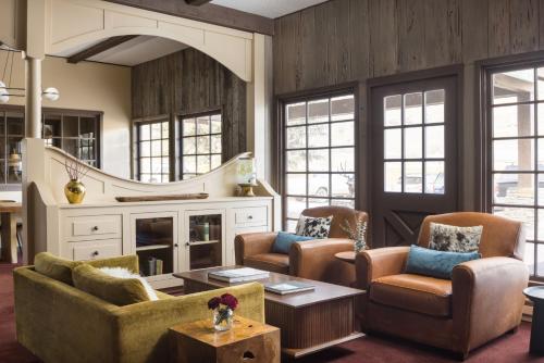 a living room with chairs and a table at The Virginian Lodge in Jackson