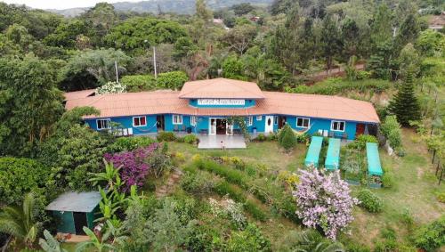 an aerial view of a blue house on a hill at Hotel Anachoreo in Santa Fe