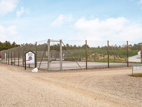 a chain link fence with a soccer goal at Pet-friendly Rømø Getaway Apartment in Sønderby
