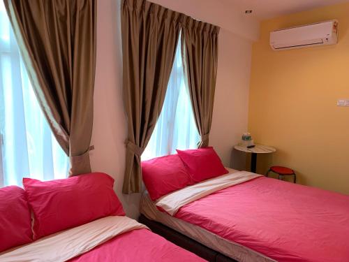 En eller flere senger på et rom på Famosa 2 Stay