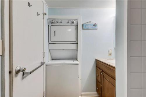a small kitchen with an oven and a sink at El Capitan in Ocean City