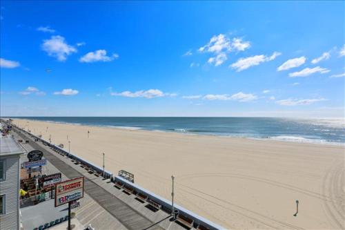 a view of a beach with a pier and the ocean at El Capitan in Ocean City