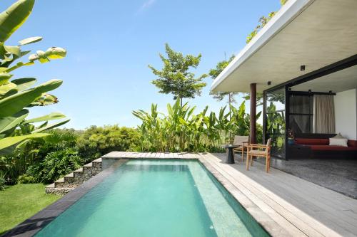 a swimming pool in the backyard of a villa at MAUA Nusa Penida Bali in Nusa Penida