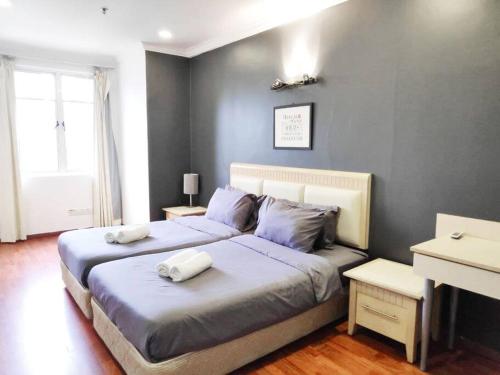 Giường trong phòng chung tại Eco One Bedroom Apartment @ Jalan Ampang, 3 pax