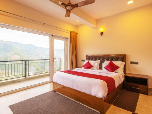 a bedroom with a bed and a large window at Captains Paradise Luxury Resort at Mukteshwar Hill Station in Mukteswar