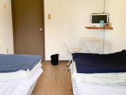 Una cama o camas en una habitación de 五岳庵