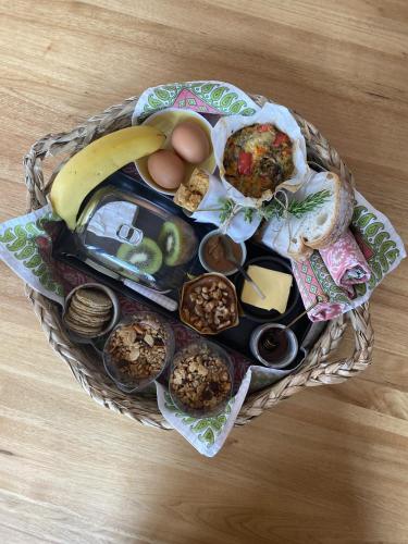 a basket of food with eggs bread and other foods at Soul Vie Stay in Launceston