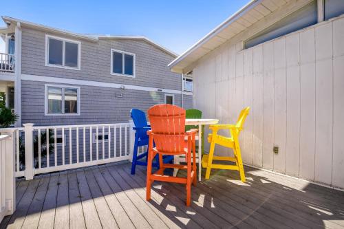 three chairs and a table on a deck at Town of Fenwick island --- 1310 Bunting in Fenwick Island