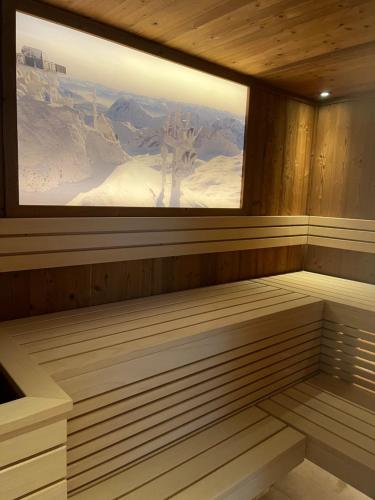 a sauna with a view of a snowy mountain at Quartier Severin in Berwang