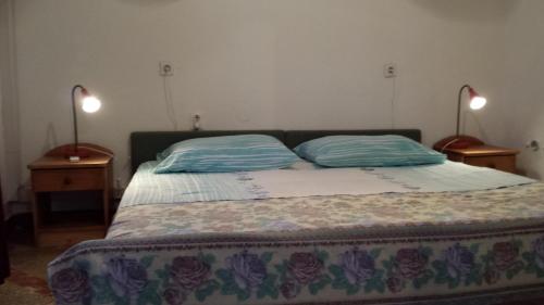 Кровать или кровати в номере Apartman Mia 2&2